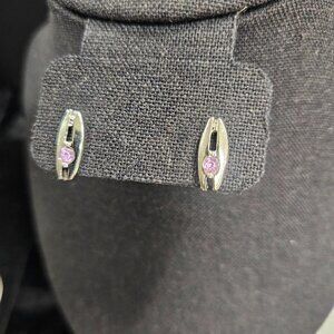 Silver tone earrings with pink rhinestone